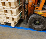 Tough Stripe in aisle with forklift