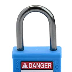 A blue safety padlock with a metal u-shaped shackle and a matching-color key propped up in front of it. The plastic padlock body has a &DANGER LOCKED OUT& label.