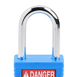A blue safety padlock with a metal u-shaped shackle and a matching-color key propped up in front of it. The plastic padlock body has a &DANGER LOCKED OUT& label.