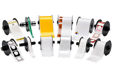 Rolls of Brady labels displayed over a white background.