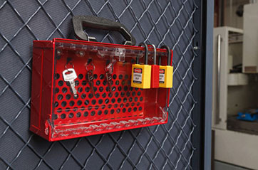 Keyed alike padlocks with their keys in a case.