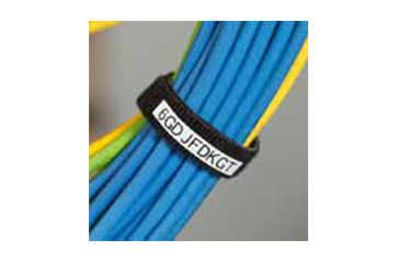 A labeled hook keeping several dozen cords bundled together and organized.