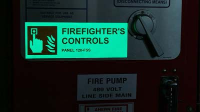 A glow-in-the-dark label identifies firefighter controls.