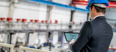 Man generating transaction data within the end-to-end Brady manufacturing process